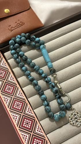 A blue sky wavy prayer bead with gray color