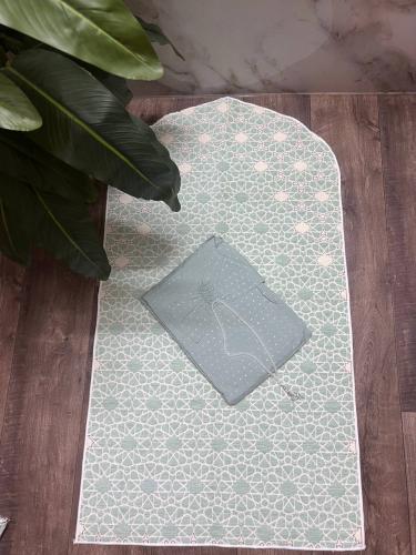 A set of a rug with geometric patterns and prayer...