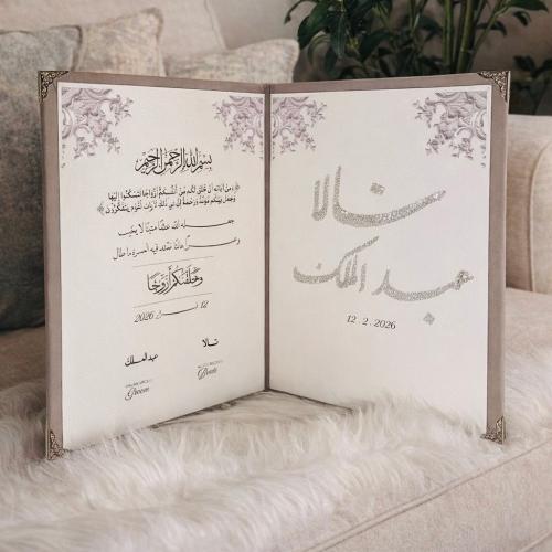 The bride's dress embroidery on one side with a na...