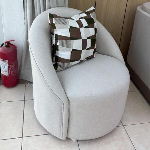 A pouffe chair with a distinctive design
