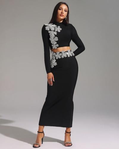 طقم أسود فاخر بزهور كريستالية لامعة - توب وتنورة ط...