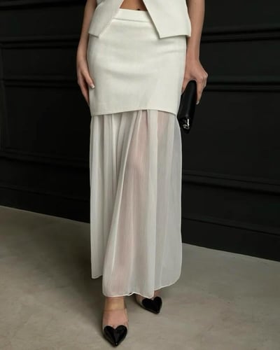 طقم نسائي قطعتين سترة بدون أكمام وتنورة طويلة مطوي...