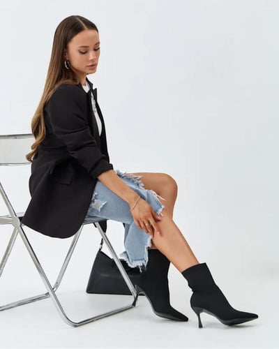 حذاء بوت نسائي بكعب عالي وتصميم جورب مرن – أسود كل...