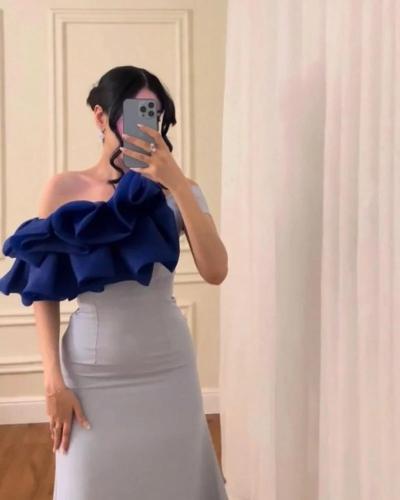 فستان سهرة بلونين وتصميم الأورجانزا المكثف