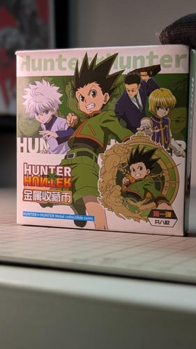 ميدالية معدنية لشخصية غون من القناص هنتر.