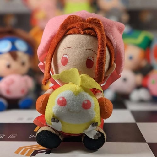 دمية مي ميمي من أبطال الديجيتال مع المرافق.