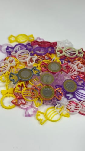 قطعة لتثبيت العملة المعدنية بشكل حلاوة (25) حبة