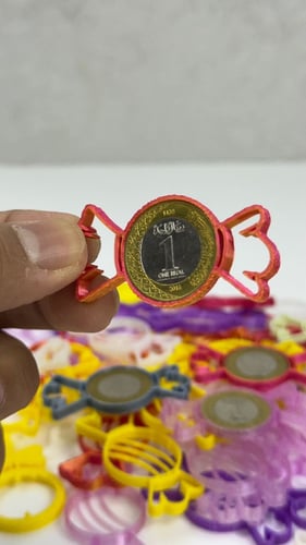 قطعة لتثبيت العملة المعدنية بشكل حلاوة (25) حبة