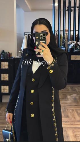 Blazer with an inner piece connected to gold butto...