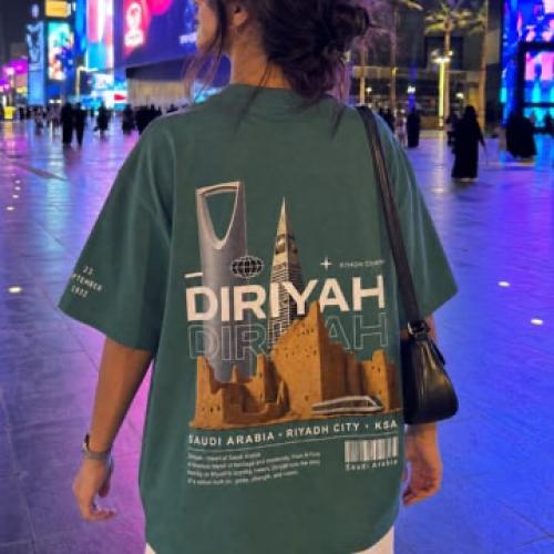 Green T-shirt with Diriyah design and Riyadh buildings