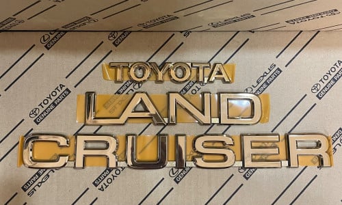 كلمة لاندكروزر ذهبي 98-2002 اصليه