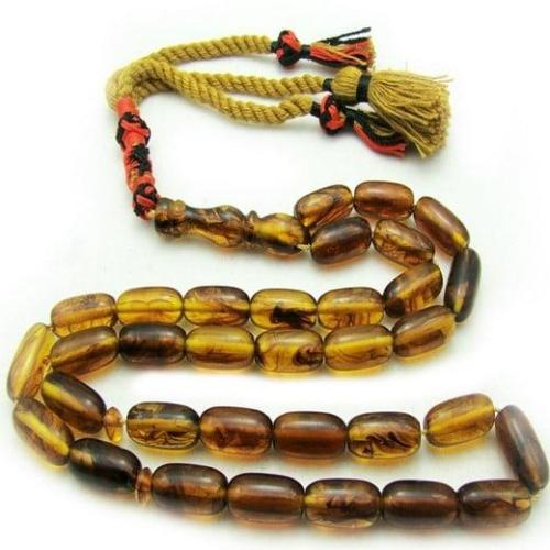 سبحة تراب كهرمان اسطوانية حشرى شفاف اللون