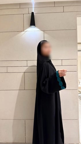 A line with Turquoise Tricot and Wide Sleeves