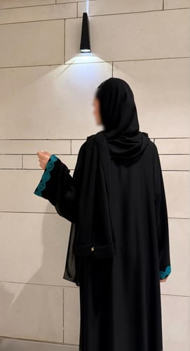 A line with Turquoise Tricot and Wide Sleeves