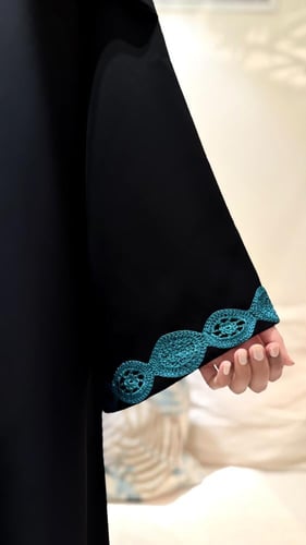 A line with Turquoise Tricot and Wide Sleeves