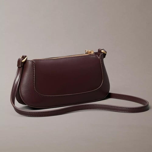 شنطة كروسبودي كالفن كلاين لون برغندي