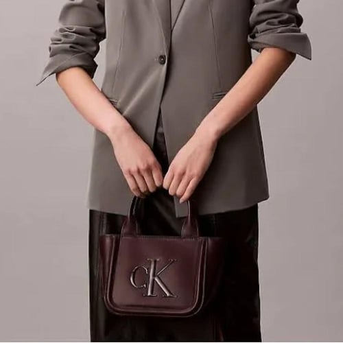 شنطة يد كالفن كلاين لون برغندي