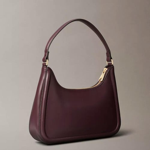 شنطة كتف كالفن كلاين لون برغندي