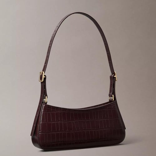 شنطة كتف كالفن كلاين لون برغندي