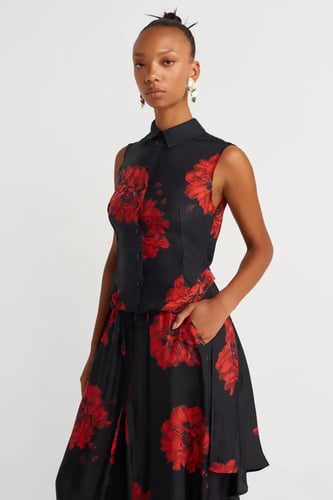 قميص أسود بدون أكمام بنقشة زهور وقصة طويلة من الخل...