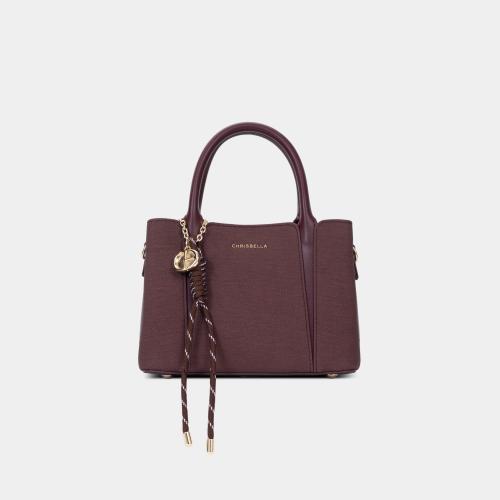 شنطة نسائية صغيرة بشرائط منسدلة لون برغندي