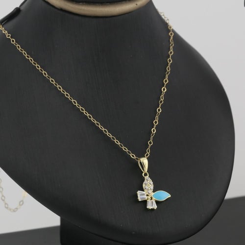 طقم ذهب اطفال زهرة بلون الميناء السماوي و الزركون...