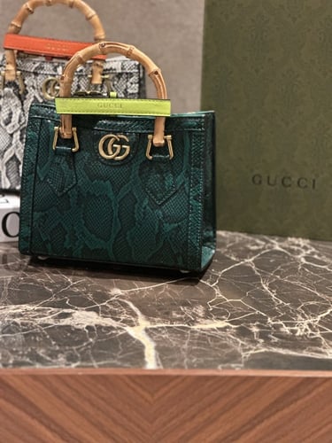 شنطة بيد خشب خيزران من قوتشي