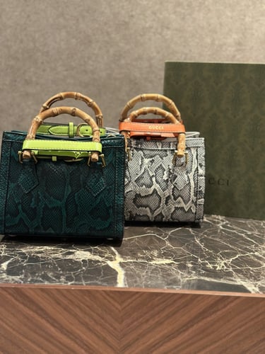 شنطة بيد خشب خيزران من قوتشي