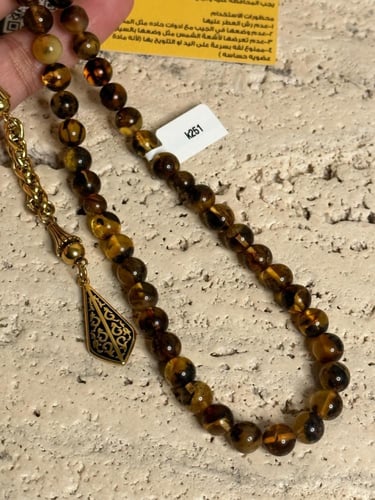 سبحة كهرمان حر شوائب طبيعية مذهب مع شكة ذهبي