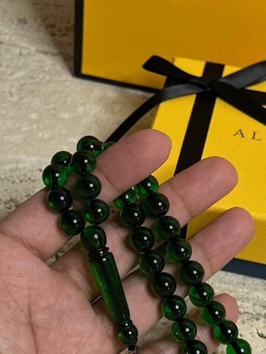 سبحة اخضر غامق بكلايت مع طربزونه فضة.