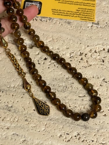 سبحة كهرمان حر شوائب طبيعية مذهب مع شكة ذهبي