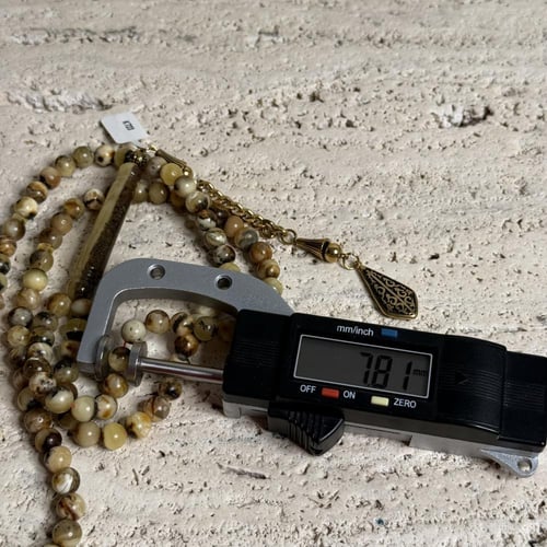 سبحه كهرمان حر شوائب طبيعية مع ستيل ذهبي