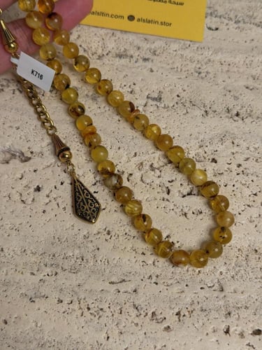 سبحه كهرمان حر شوائب مع ستيل ذهبي ونحت اسم احبك من...