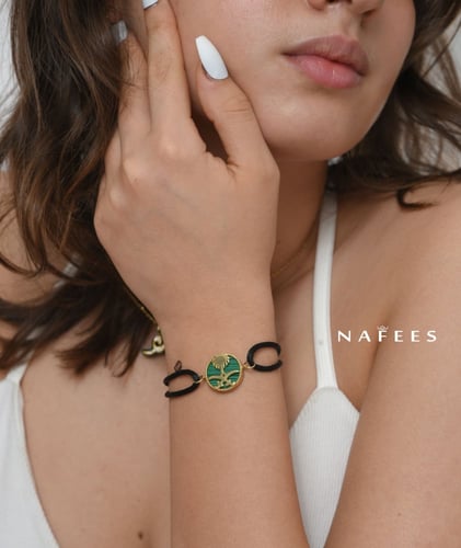 اسوارة مميزة سيفين و نخلة مرصعة بالزيركون و الفضة...