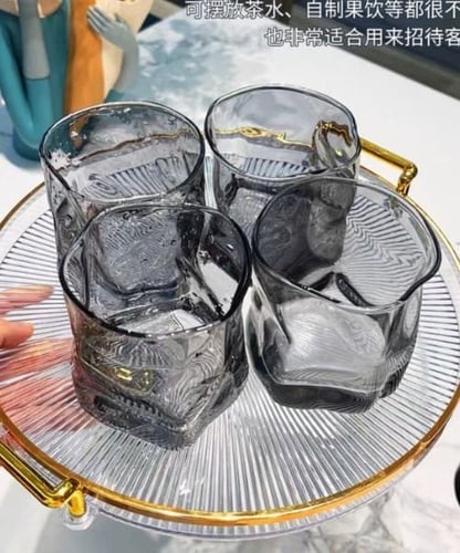 صينية تقديم اكريليك دائرية بمقبض ذهبي شفاف