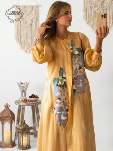 عباية مع فستان بتطريز انيق برتقالي