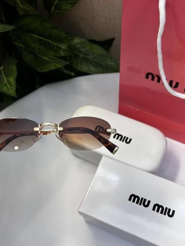 نظارة miu miu أطار ذهبي تايقر عدسة بني