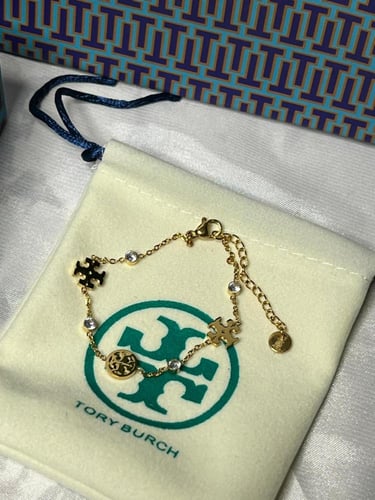 إسوارة TORY BURCH معدن ذهبي بفصوص