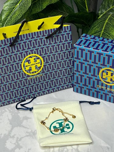 إسوارة TORY BURCH معدن ذهبي بفصوص