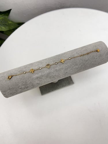 إسوارة TORY BURCH معدن ذهبي بفصوص