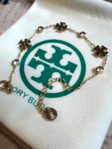 إسوارة TORY BURCH معدن ذهبي بفصوص