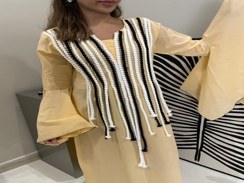 جلابية بلون خربزي