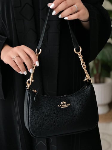 حقيبة كوتش مستر الأنيقة باللون الأسود - تصميم فاخر...