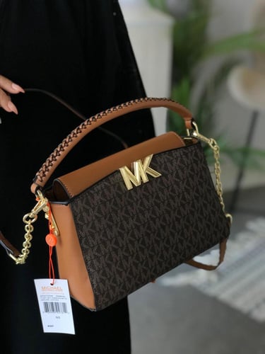 حقيبة مايكل كورس الأنيقة - لمسة فاخرة لإطلالة متكا...