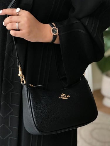 حقيبة كوتش مستر الأنيقة باللون الأسود - تصميم فاخر...