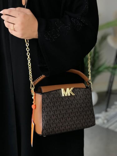 حقيبة مايكل كورس الأنيقة - لمسة فاخرة لإطلالة متكا...