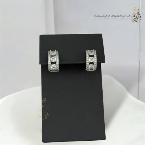 Sparkling zircon earrings with a large stone