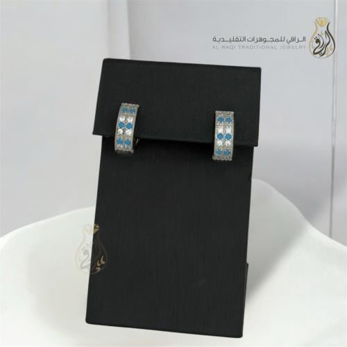 أقراط دائرية مرصعة بزركون أزرق