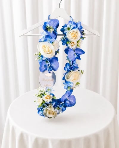 Graduation necklace with blue artificial flower