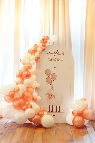 Eid al-Adha stand with the sheep with balloons